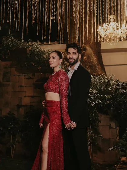 Styling Avantika for her Mumbai reception in this stunning red Ritika Mirchandani ensemble. The look was bold and glamorous, perfectly coordinated with her groom's classic black suit for a powerful couple statement.