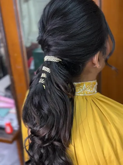 The full look of the modern curly ponytail, a favorite among my students for its chic and trendy vibe.