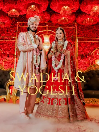 A poster-style image of the couple against a dramatic red floral backdrop.