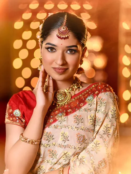 A radiant festive look created for a Diwali-themed shoot. The makeup features a classic winged liner, warm-toned eyeshadow, and a soft matte lip, paired with traditional gold jewelry.
