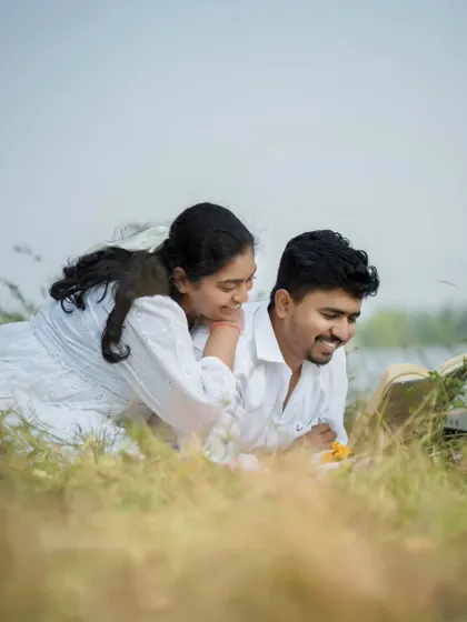 Sharing a story together. This pre-wedding photo captures a quiet, intimate moment of connection.