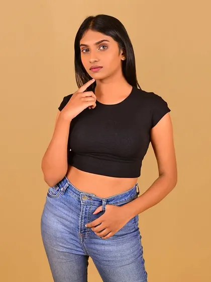 A thoughtful pose with subtle makeup that enhances her natural features for her headshot.
