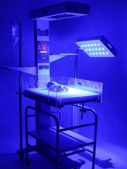 Our studio is equipped for specialized photoshoots, including technical medical equipment. This shot of a neonatal warmer with its phototherapy light activated demonstrates our ability to capture products in their functional state, highlighting key features for professional catalogs and websites.