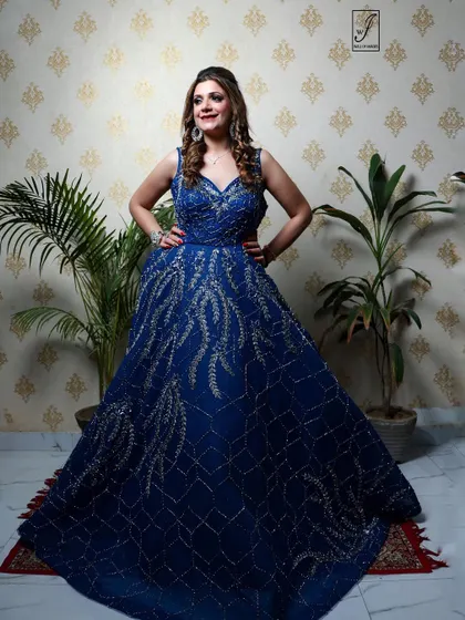 A confident pose with hands on hips, emphasizing the structure and fit of the formal gown.