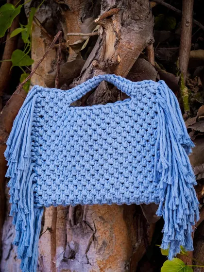 For a softer look, here is the same fringe handbag design in a lovely icy blue. ❄️ This color is so serene and versatile. All my bags are washable and can be customized in over 20 shades to match your personal style.