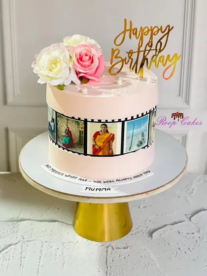 A cake that tells a story. This design for 'Mumma' features an edible photo reel of cherished memories, topped with fresh roses.