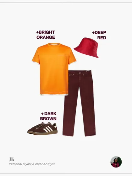 A visual guide to styling wine-colored trousers. This outfit pairs them with a bright orange t-shirt, a deep red bucket hat, and dark brown sneakers for a bold, stylish look.