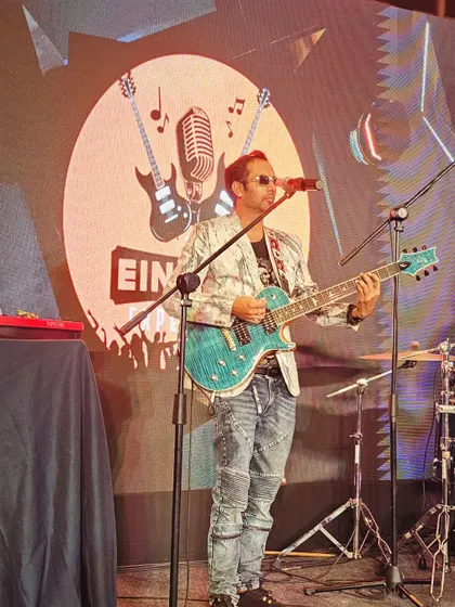 Our lead singer on stage during a corporate performance for State Bank of India at The Oterra Hotels.