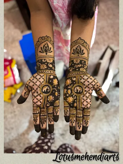 A stunning non-bridal design featuring elephant and lotus motifs, showcasing that guest mehendi can be just as detailed and beautiful.