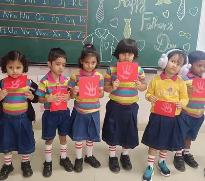More proud students with their red handprint cards, a simple yet meaningful token of their love.