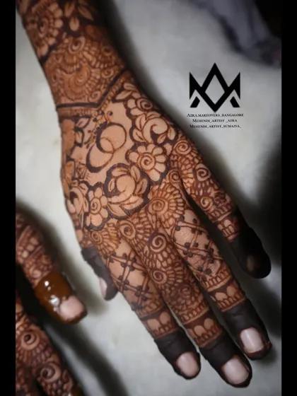 A detailed shot of the floral work on the palm for this engagement mehendi.