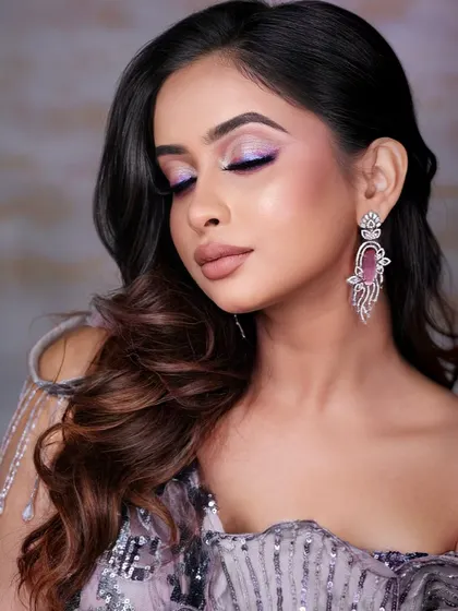 A final close-up of this creative eye look. The shimmer and color shift of the holographic liner are captured perfectly, showing the high-impact results of this technique.