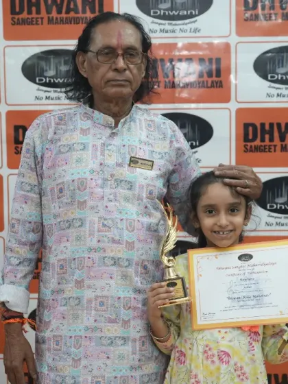 A senior guru with his young student, a moment of pride.
