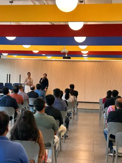 An interactive moment during a corporate workshop where I engage with the audience, answering questions about workplace wellness.