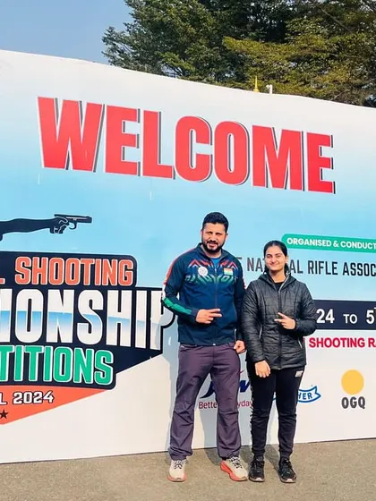 A proud moment with junior national champion Niyamicka at the 67th National Shooting Championship. My goal is to turn promising young shooters into national champions.