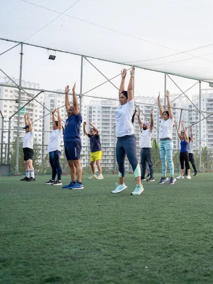 A duplicate of the group warm-up, highlighting the synchronized energy of the participants.