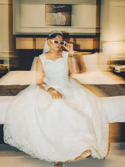 A creative bridal portrait with a double exposure effect. This artistic shot is modern and adds a dynamic, edgy feel to the collection.