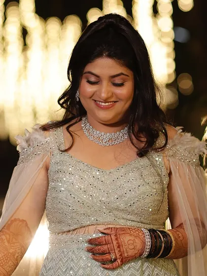 A happy and radiant bride. The dewy skin and soft glam makeup create a look that is both youthful and elegant.