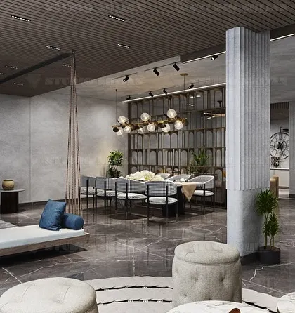 Another view of the Palam Vihar party hall, showing the dining area's proximity to a comfortable lounge space with a large indoor swing.