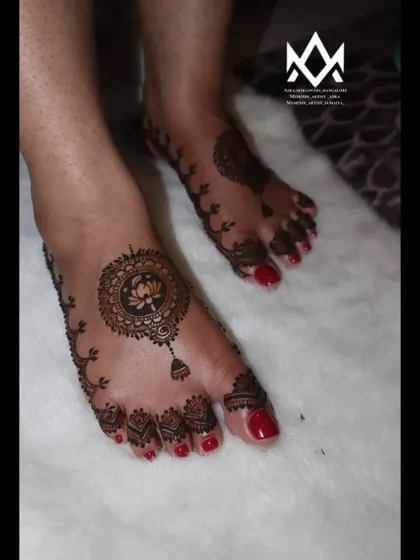 A simple and elegant foot design featuring a lotus mandala, perfect for a guest or a minimalist bride.