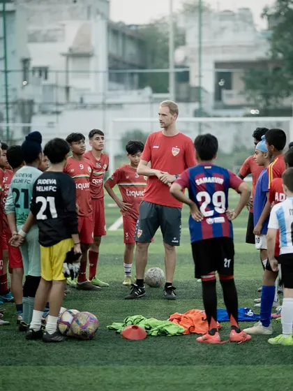 A group of our youngest players listens intently to a coach from VfB Stuttgart. We believe in starting early, instilling world class techniques and a disciplined approach to training from the very beginning of a player's journey.