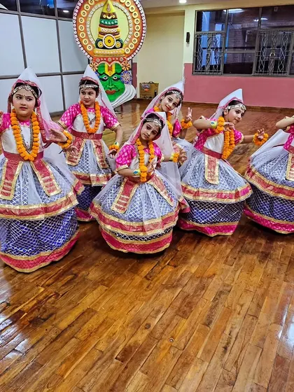 A group of our youngest performers in beautiful Kathak-style costumes, ready for their moment on stage.