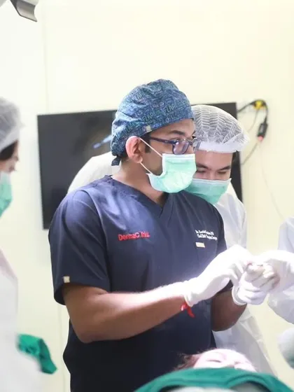 I am demonstrating a specific surgical technique to an attentive group of doctors during the FUEASIA ASEAN Regional Workshop in Bangkok. These close-up sessions are crucial for learning fine motor skills.