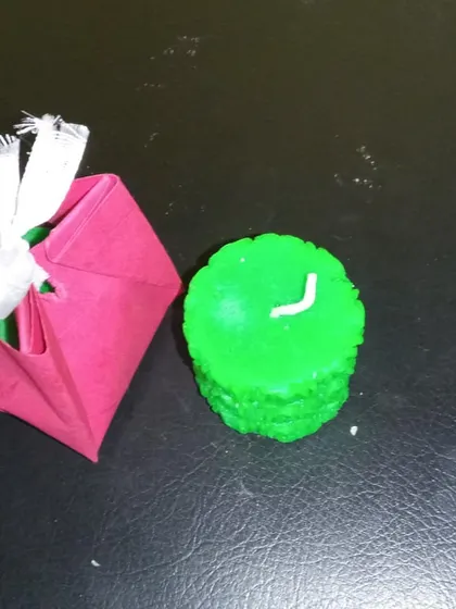 Another view of my decorative candle with its gift packaging. I focus on the candle itself, but simple packaging is available for gifting.