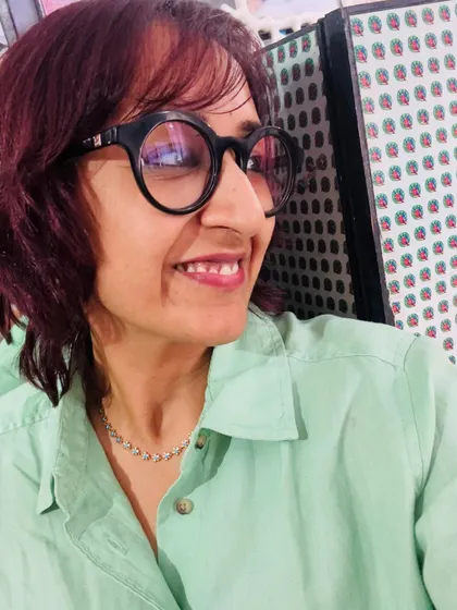 A side profile, smiling in my casual Monday outfit.