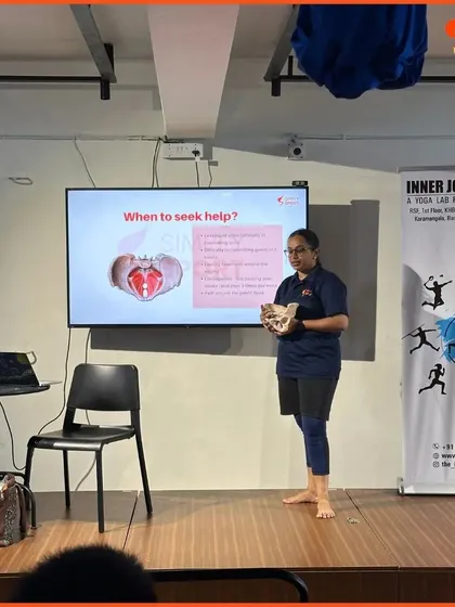 A wide shot of our workshop with elite football players, showing the facilitator explaining the pelvic floor. These deep dives into anatomy are crucial for athletes to understand injury prevention and core strength.