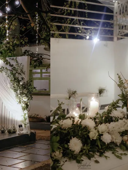 Detail shots of the evening reception decor, including candlelit tables and draped fabric with floral accents, which add to the romantic atmosphere.
