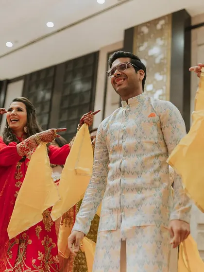 The groom's side playfully teases the bride's side during the Haldi festivities.
