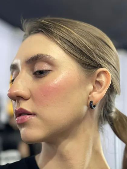 A close-up of the 'blush draping' technique for a FAD International fashion show. This creates a soft, flushed look with dewy skin that looks beautiful on the runway.