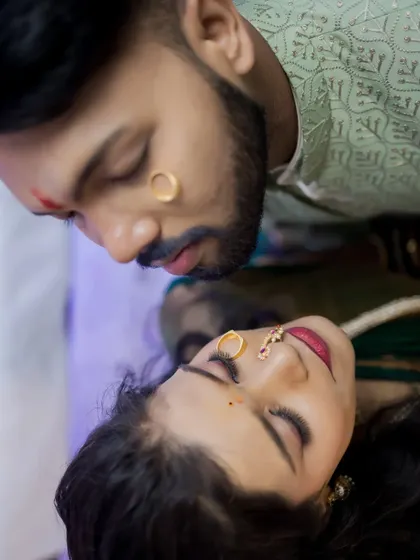 An artistic and intimate portrait using reflections to capture the couple's connection during their engagement ceremony.