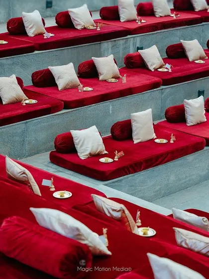 Rows of plush velvet mattresses and cushions transform the stone steps into comfortable and regal seating.