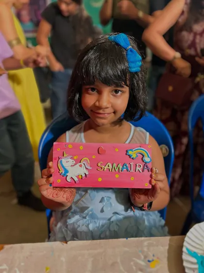 This young girl is so proud of the personalized unicorn nameplate she painted at our Sunday Soul Sante stall. It was a day full of color and happy vibes.
