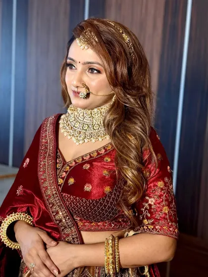 This bride looks absolutely radiant. The makeup is bold but not heavy, allowing her natural beauty to shine through.
