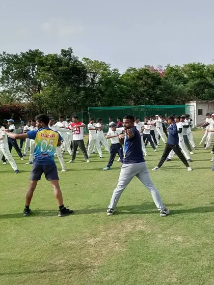 A yoga session in progress. We believe in a holistic approach to fitness, and yoga helps improve flexibility, balance, and mental focus.