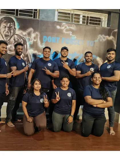 My team, my family. Here are my boys, ready to dominate at the National Powerlifting Championship. We train together, we compete together, and we win together.