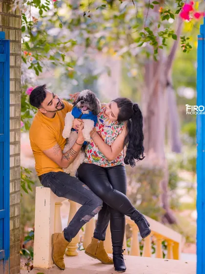 A fun and adorable shot of a couple with their furry friend. Including pets in your pre-wedding photos is a wonderful way to celebrate your whole family.