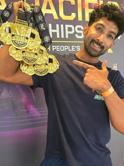 Pointing to the medals. This is the result I help my clients work towards.