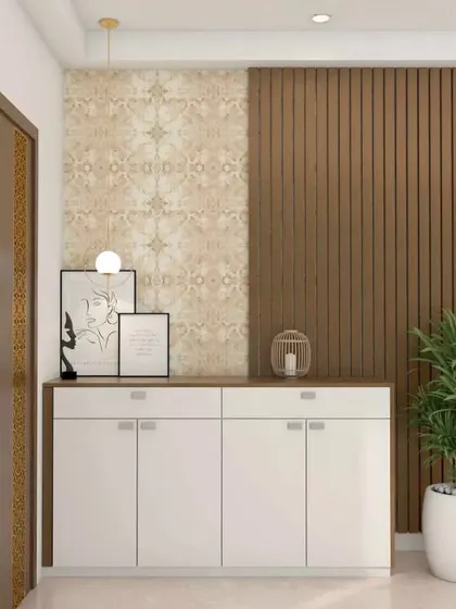This foyer combines a white shoe cabinet with a wood-paneled accent wall and patterned wallpaper. The mix of textures creates a visually interesting and welcoming space.