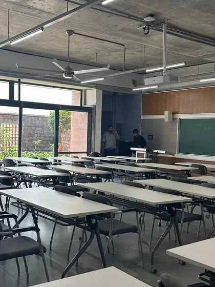 A classroom at Azim Premji University, which opens out onto a landscaped courtyard. This connection to the outdoors provides natural light and a calming view for students.
