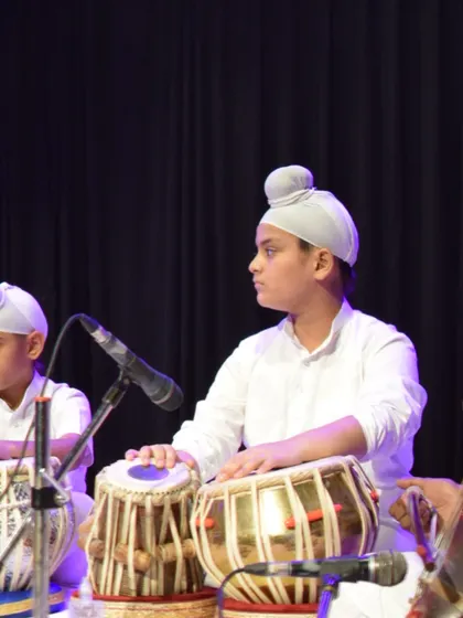 A student concentrating on his performance during our annual concert. Each student gets the opportunity to perform on a professional stage.