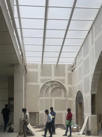 The arches and retractable roof structure are in place. This image shows the project mid-construction, with the core architectural elements defining the future space.