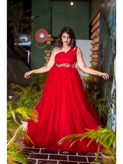 The client in the red tulle gown, showing how the skirt flows.