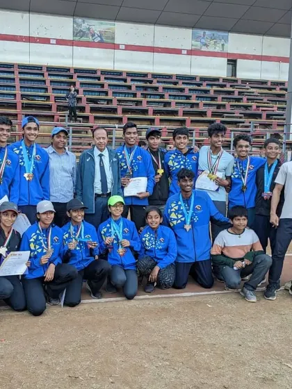 The team celebrating a haul of medals at the 45th YMCA Open State Level Athletic Championship.