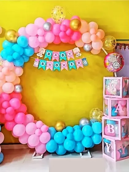 Here's a fun and festive baby shower decoration I did in a client's home. The multi-colored balloon arch is paired with a "Baby Shower" banner, B-A-B-Y boxes, and an "It's a Boy" foil balloon.