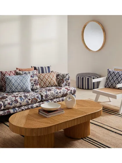 The 'Vance' collection brings traditional patterns alive with a modern aesthetic. This living room scene shows how I mix floral sofas with geometric and striped cushions for a timeless and whimsical look.