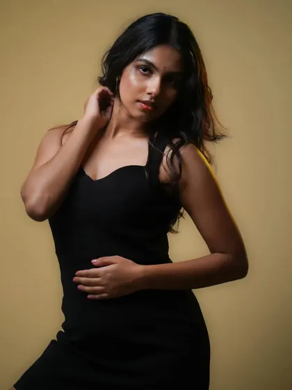 A classic three-quarter portrait against a warm, neutral background. This is a staple for any model or actor's portfolio, highlighting their natural look.